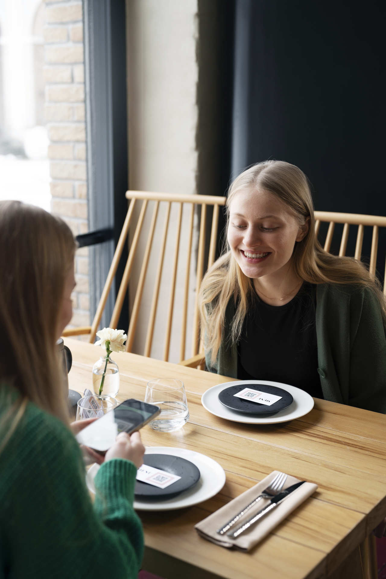 woman-scanning-qr-code-with-phone